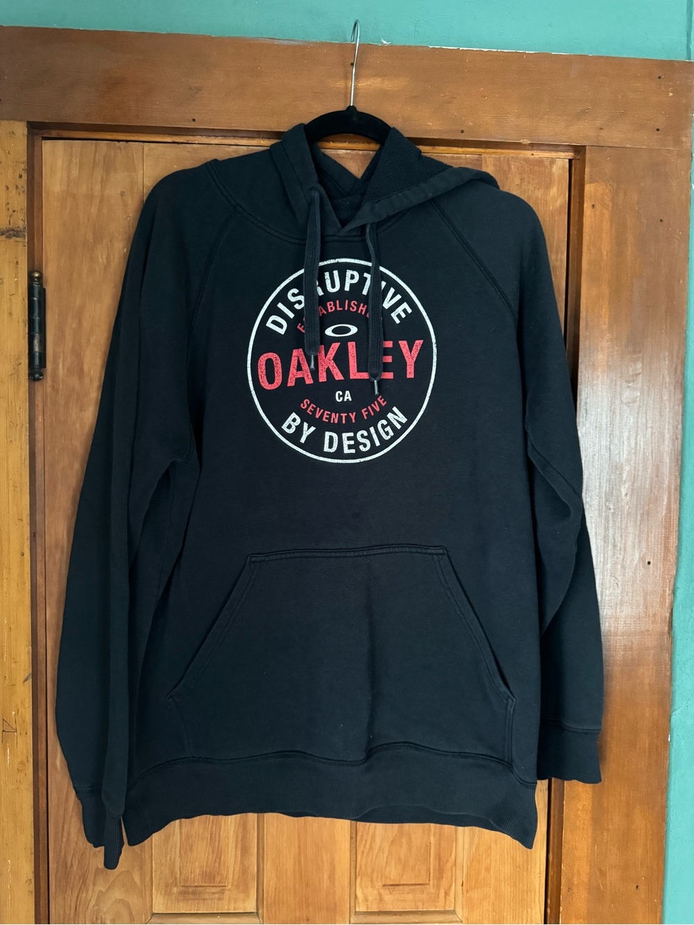 Oakley Black Pullover Hoodie with Red Logo Circle Graphic